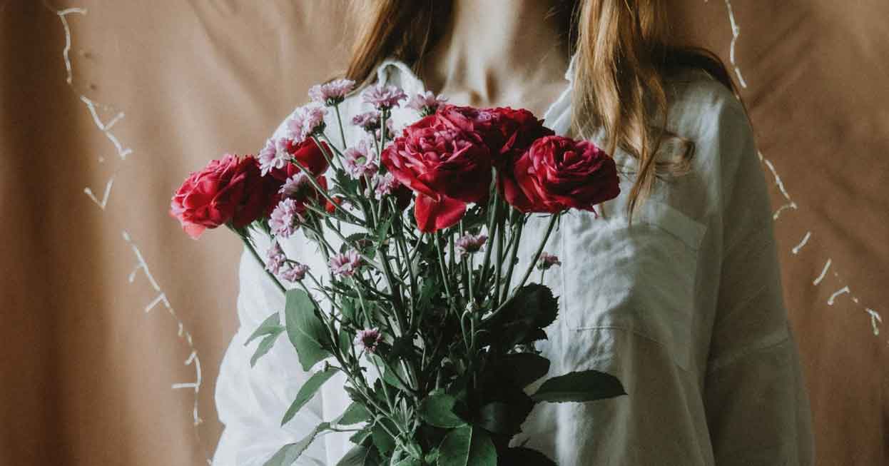 woman holding a bouquet of flowers