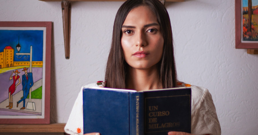 Woman holding a book.